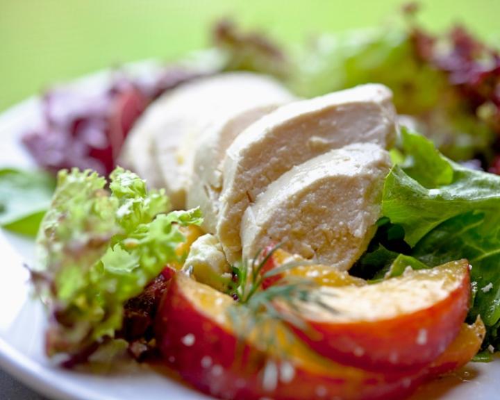 A plate of poached chicken for an easy and healthy dinner for diabetic diets