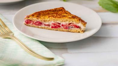 Stuffed strawberry French toast slice on white plate