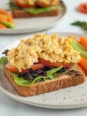 An open face vegan vegetarian sandwhich with chickpea and carrots and celery on a plate for diabetes friendly diet