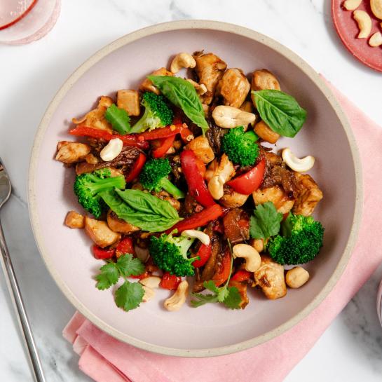A bowl of Date & Cashew Chicken Stir Fry for a diabetes friendly healthy meal