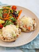 Tuna salad melt served with a salad on a plate
