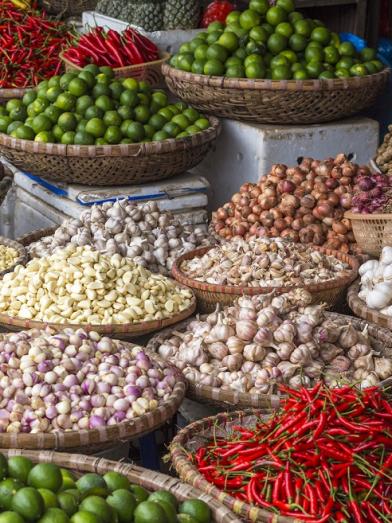 A variety of baskets filled with herbs and veggies from around the world for make global diabetes friendly recipes