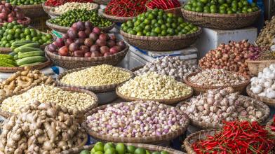 A variety of baskets filled with herbs and veggies from around the world for make global diabetes friendly recipes