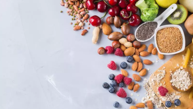 Scattered foods high in fiber like nuts, beans, and berries